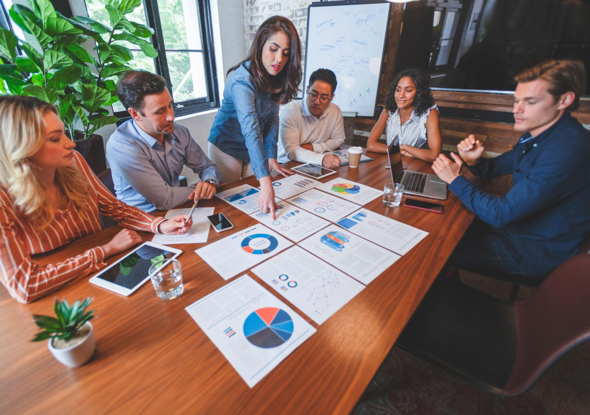 Analysts reviewing financial reports together
