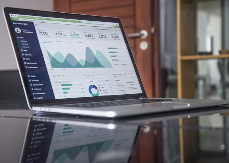 Laptop screen showing investment analytics charts