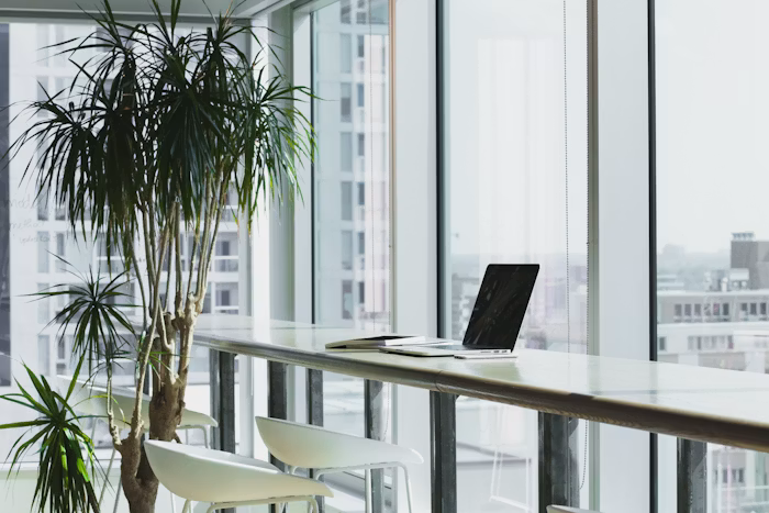 Desk with laptop and notes for financial planning